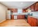Well-lit kitchen features stainless steel appliances, granite countertops, and wooden floors at 1838 Nicole Ln, Lithonia, GA 30058