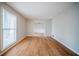 Bright living room featuring hardwood floors, neutral walls, and large window at 1838 Nicole Ln, Lithonia, GA 30058