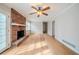 Cozy living room with brick fireplace and hardwood floors, perfect for relaxing or entertaining at 1838 Nicole Ln, Lithonia, GA 30058