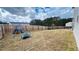 Spacious fenced backyard with a playset and ample room for outdoor activities at 720 Dove Tree Ln, Social Circle, GA 30025