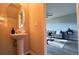 Powder bathroom with pedestal sink and mirror at 720 Dove Tree Ln, Social Circle, GA 30025