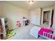Cozy bedroom with a bed, study desk and carpet floor at 720 Dove Tree Ln, Social Circle, GA 30025