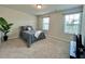 A bedroom with two windows, a bed and a television at 720 Dove Tree Ln, Social Circle, GA 30025