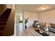 Living room with hardwood floors and a staircase at 720 Dove Tree Ln, Social Circle, GA 30025