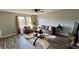 Open concept living room with wood floors and neutral paint at 720 Dove Tree Ln, Social Circle, GA 30025