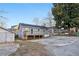 Grey house exterior featuring a wooden deck and an adjacent shed at 1268 Wylie Se St, Atlanta, GA 30317