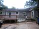 Back exterior of the home with a spacious wooden deck and well-maintained yard at 1268 Wylie Se St, Atlanta, GA 30317