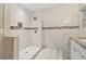 Bathroom featuring white tiling, granite counters, shower with curtain, mosaic tile accent, and recessed shower niche at 1268 Wylie Se St, Atlanta, GA 30317