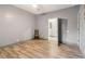 Bedroom featuring wood-look floors, neutral walls, ceiling fan, and an open door leading to other rooms at 1268 Wylie Se St, Atlanta, GA 30317