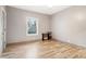 Cozy bedroom featuring wood-look floors, neutral walls, ceiling fan, and a window that provides natural light at 1268 Wylie Se St, Atlanta, GA 30317