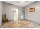 Bedroom featuring wood-look floors, neutral walls, ceiling fan, and an open door leading to other rooms at 1268 Wylie Se St, Atlanta, GA 30317