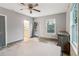 Bedroom with hardwood floors, ceiling fan, a back door to the outside, and views from the window at 1268 Wylie Se St, Atlanta, GA 30317