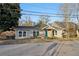 Exterior shot of a charming home featuring a bright blue front door and tidy landscaping at 1268 Wylie Se St, Atlanta, GA 30317