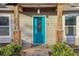 Close up of a bright blue front door with decorative glass and a covered porch at 1268 Wylie Se St, Atlanta, GA 30317