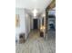 Hallway showcasing natural light, decorative painting, and hardwood floors at 1268 Wylie Se St, Atlanta, GA 30317