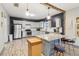 Modern kitchen with gray cabinets, stainless steel appliances, and a center island at 1268 Wylie Se St, Atlanta, GA 30317