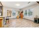 Open kitchen with gray cabinets, granite counters, and wood-look tile floors at 1268 Wylie Se St, Atlanta, GA 30317