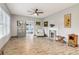 Open living room with wood flooring, a decorative fireplace, and ample natural light at 1268 Wylie Se St, Atlanta, GA 30317