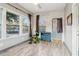 Bright living room features wood-look tile floors, brick accent wall, and a view to the yard at 1268 Wylie Se St, Atlanta, GA 30317