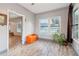 Inviting living room with wood-look tile floors, large windows, and neutral wall color at 1268 Wylie Se St, Atlanta, GA 30317