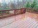 Inviting outdoor back deck, perfect for relaxation and enjoying the serene wooded view at 1831 Nours Landing Way, Duluth, GA 30097