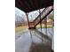 Backyard view with wooden staircase, lawn and wooded background at 1831 Nours Landing Way, Duluth, GA 30097