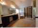 Bathroom featuring a double vanity, separate shower and tub, and tile flooring at 1831 Nours Landing Way, Duluth, GA 30097