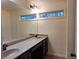 Bathroom featuring a double vanity with granite countertops and modern fixtures at 1831 Nours Landing Way, Duluth, GA 30097