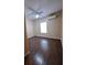 This bedroom features hardwood floors, neutral colors and a ceiling fan at 1831 Nours Landing Way, Duluth, GA 30097