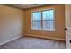 Bedroom with neutral walls, carpet flooring, and large windows at 1831 Nours Landing Way, Duluth, GA 30097