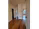 Hallway with hardwood floors connecting various rooms in the house at 1831 Nours Landing Way, Duluth, GA 30097