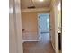 Hallway with neutral walls and carpet flooring, providing access to other rooms at 1831 Nours Landing Way, Duluth, GA 30097