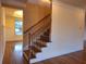 Hardwood staircase with metal railings, connecting the home's levels at 1831 Nours Landing Way, Duluth, GA 30097