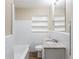 Cozy bathroom with granite countertop, stylish sink, and integrated shelving at 6297 Temple St, Lithia Springs, GA 30122