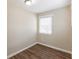 A tidy room with wood flooring, neutral paint and a window with adjustable blinds at 6297 Temple St, Lithia Springs, GA 30122