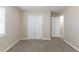 Bedroom featuring plush carpeting, neutral walls, and ample closet space at 6297 Temple St, Lithia Springs, GA 30122