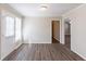 View of the living room with ceiling fan and door to the outside at 6297 Temple St, Lithia Springs, GA 30122