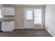 View of kitchen from the living room with light-colored walls at 6297 Temple St, Lithia Springs, GA 30122