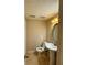 Bathroom featuring a pedestal sink, oval mirror and a standard white toilet on ceramic tile flooring at 6900 Roswell Rd # 7N, Atlanta, GA 30328