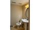 Bathroom featuring a pedestal sink, oval mirror and a standard white toilet on ceramic tile flooring at 6900 Roswell Rd # 7N, Atlanta, GA 30328