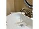 Bathroom sink with running water under a stylish, ornate mirror in a cozy, well-lit space at 6900 Roswell Rd # 7N, Atlanta, GA 30328