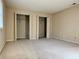 Spacious bedroom with beige carpet and two closets at 6900 Roswell Rd # 7N, Atlanta, GA 30328