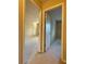 Hallway with view to a bedroom with neutral carpet and walk-in closet at 6900 Roswell Rd # 7N, Atlanta, GA 30328