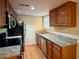 Updated kitchen features granite countertops and stainless steel appliances at 6900 Roswell Rd # 7N, Atlanta, GA 30328