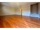 Spacious living room features hardwood floors and bright, neutral paint at 6900 Roswell Rd # 7N, Atlanta, GA 30328