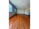 Bright living room featuring hardwood floors and large windows at 6900 Roswell Rd # 7N, Atlanta, GA 30328