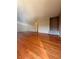 Expansive living area with gleaming hardwood floors and neutral wall color at 6900 Roswell Rd # 7N, Atlanta, GA 30328