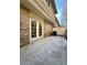 Patio featuring a brick building, with double doors leading inside and a concrete floor at 6900 Roswell Rd # 7N, Atlanta, GA 30328