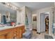 Bathroom features double sinks and decorative mirror and vanity lighting at 8034 Bradshaw Ct, Douglasville, GA 30134