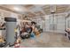 Spacious garage with ample storage space, a water heater, and a two-car garage door at 8034 Bradshaw Ct, Douglasville, GA 30134